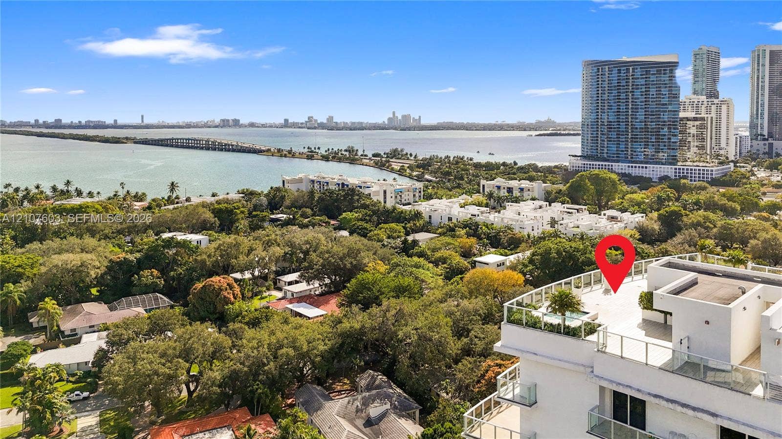 4250 Biscayne Boulevard, #1418, Miami, FL 33137 Rooftop terrace featuring glass railings, integrated landscaping, and expansive bay and skyline scenery