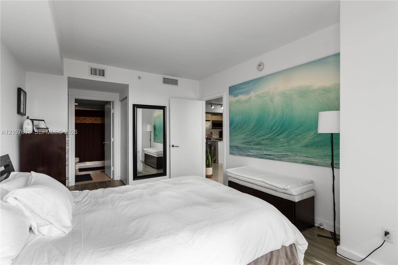 4250 Biscayne Boulevard, #1418, Miami, FL 33137 Interior space with wood-finish flooring and neutral wall paint