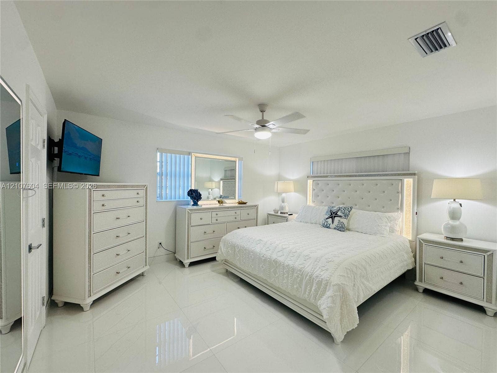 120 S 56th Avenue, Hollywood, Hollywood, FL 33023 Neutral-toned room featuring large-format tile flooring, a recessed ceiling-mounted fan, and vertical blinds