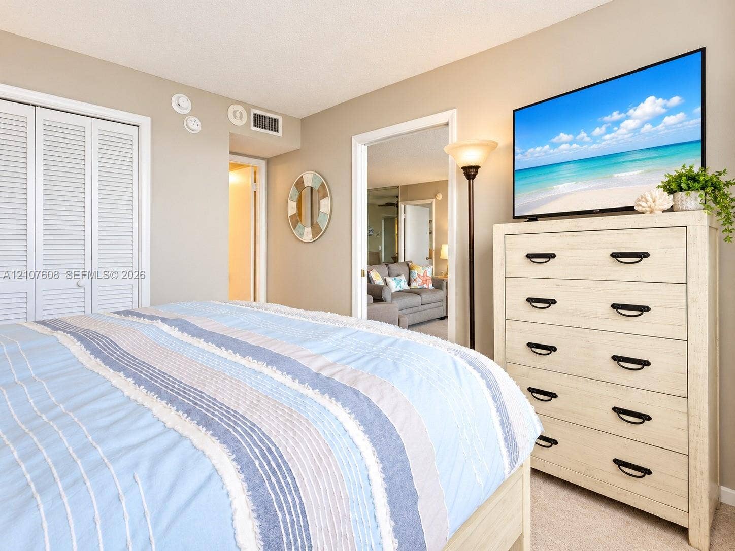 2000 S Ocean Boulevard, #12F, Lauderdale-By-The-Sea, Lauderdale By The Sea, FL 33062 Room interior featuring neutral wall paint, wall-to-wall carpeting, and double-door bi-fold closet