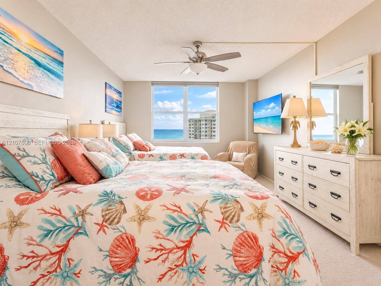 2000 S Ocean Boulevard, #12F, Lauderdale-By-The-Sea, Lauderdale By The Sea, FL 33062 Bedroom featuring a large multi-pane window with water outlook, carpeted flooring, and a ceiling-mounted light fixture with integrated fan