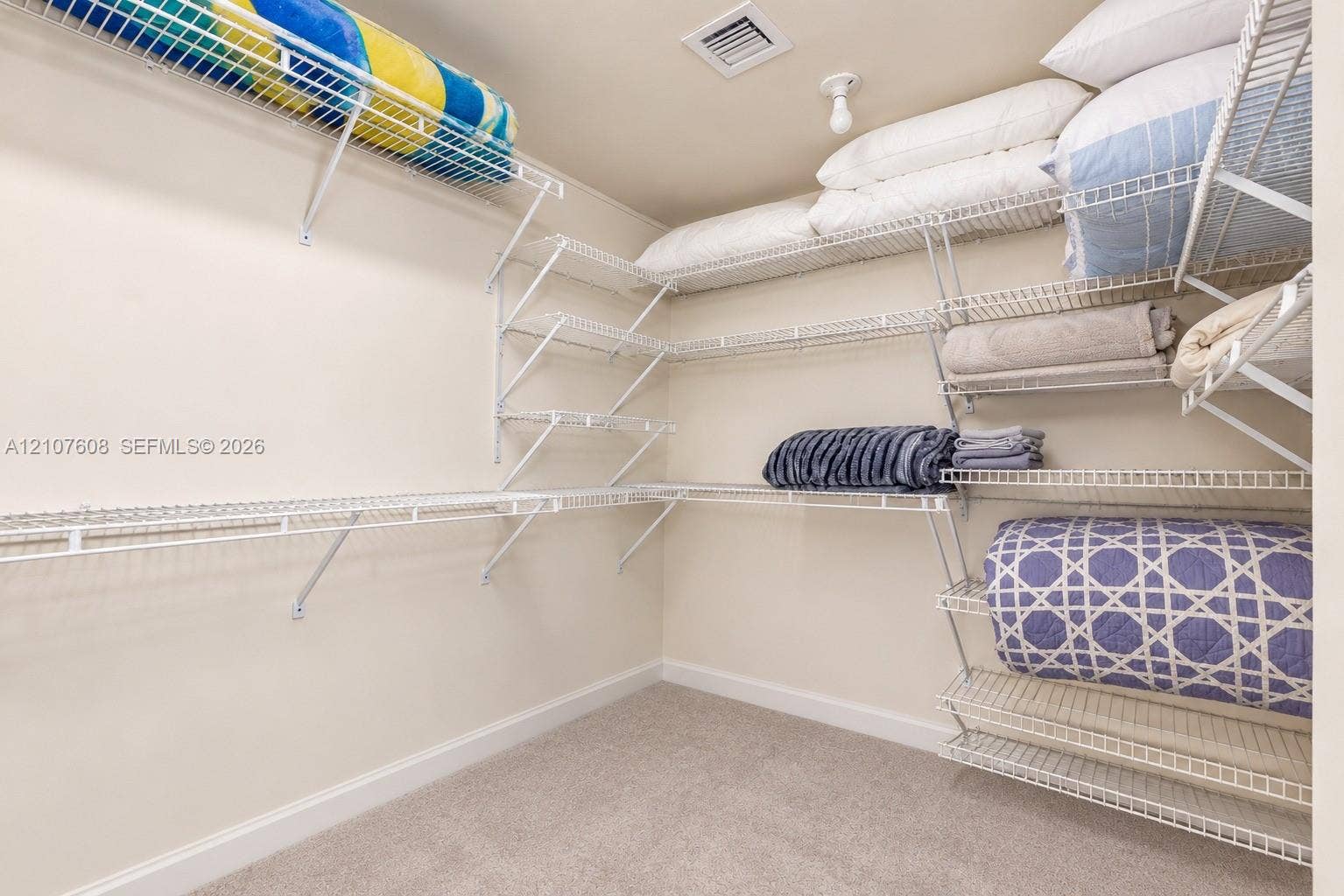 2000 S Ocean Boulevard, #12F, Lauderdale-By-The-Sea, Lauderdale By The Sea, FL 33062 Storage area featuring wall-to-wall white wire shelving and neutral carpeting