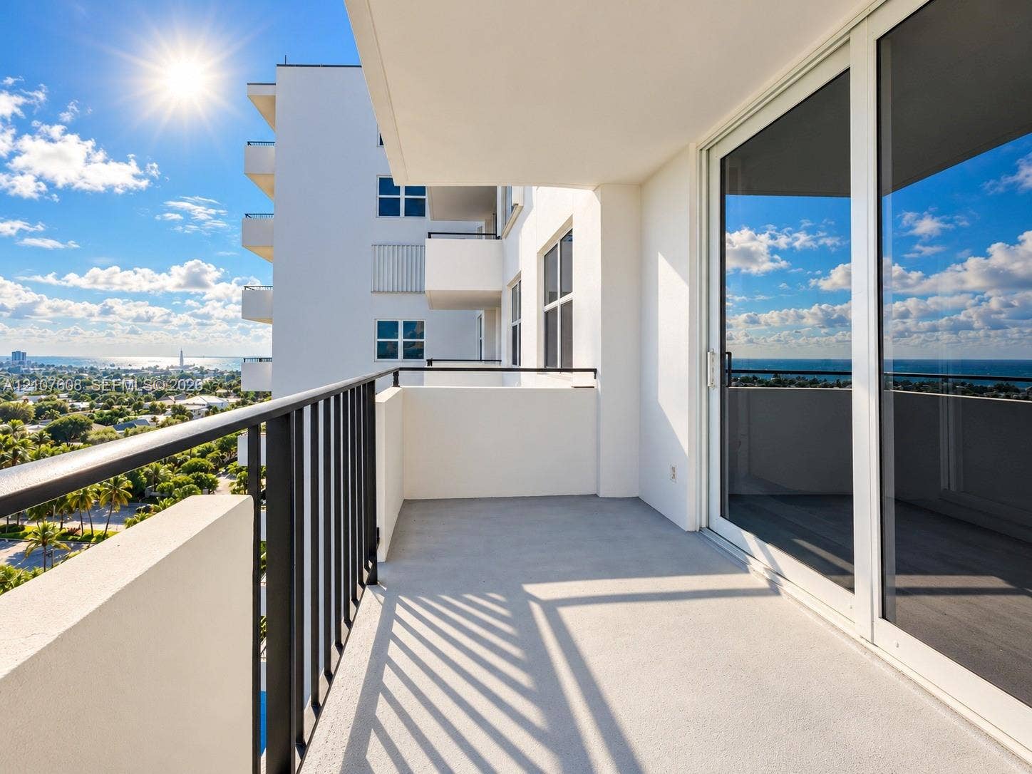 2000 S Ocean Boulevard, #12F, Lauderdale-By-The-Sea, Lauderdale By The Sea, FL 33062 Private balcony featuring a concrete surface, black metal railing, and sliding glass door access