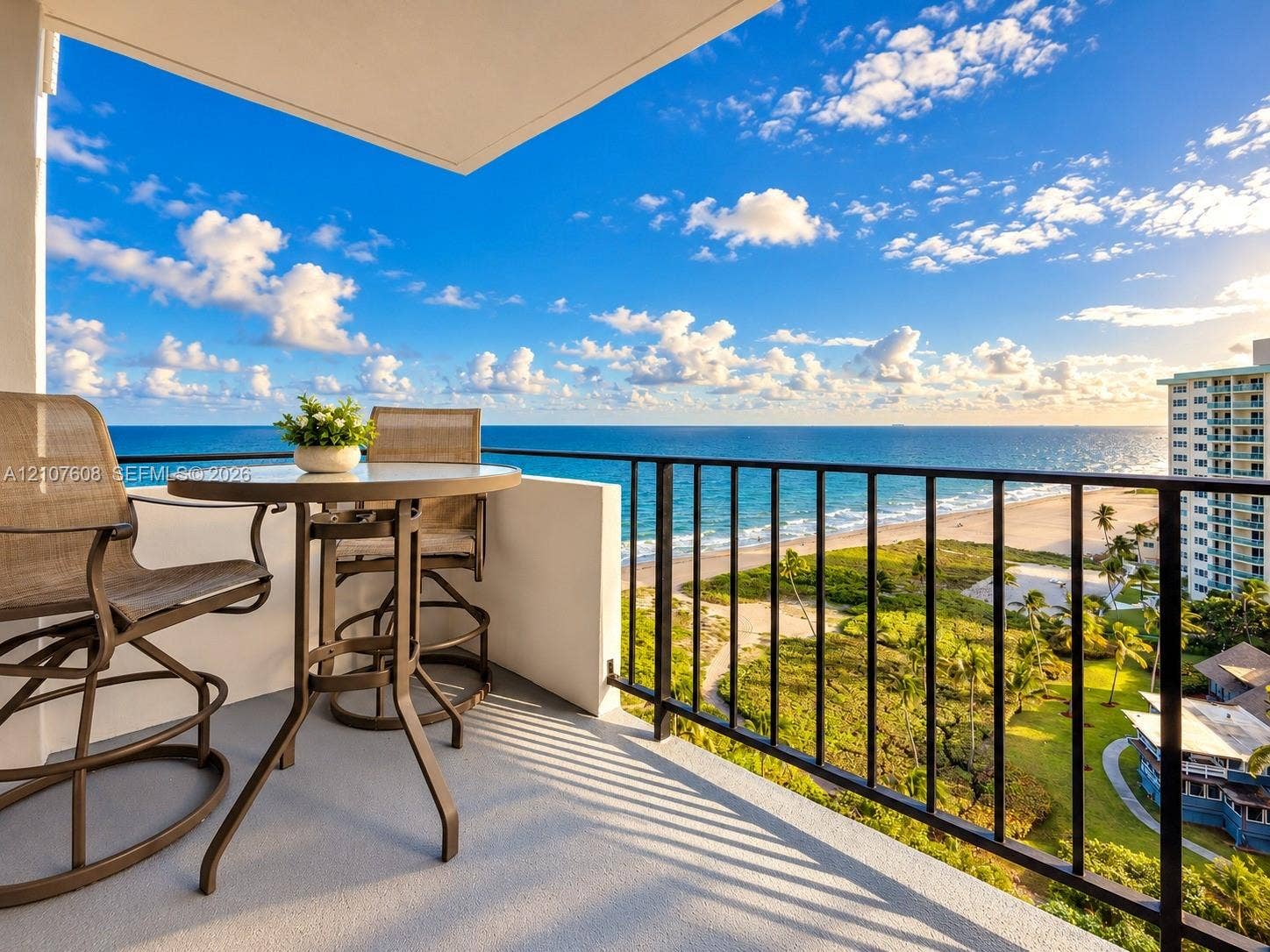 2000 S Ocean Boulevard, #12F, Lauderdale-By-The-Sea, Lauderdale By The Sea, FL 33062 Private balcony featuring a concrete floor, solid masonry wall, and black metal railing, showcasing direct oceanfront scenery