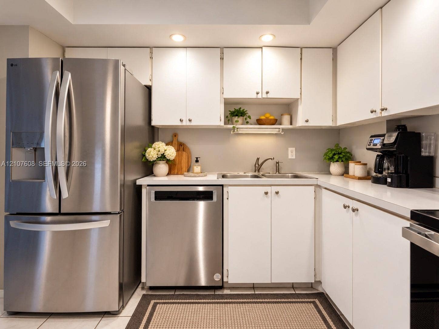 2000 S Ocean Boulevard, #12F, Lauderdale-By-The-Sea, Lauderdale By The Sea, FL 33062 Kitchen featuring white cabinetry, stainless steel French door refrigerator, stainless steel dishwasher, solid-surface countertops, and recessed lighting