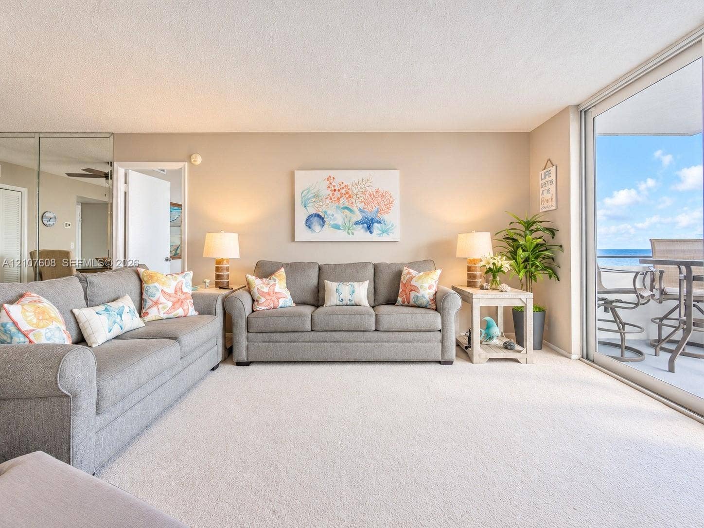 2000 S Ocean Boulevard, #12F, Lauderdale-By-The-Sea, Lauderdale By The Sea, FL 33062 Full-height mirrored wall paneling, wall-to-wall carpeting, and sliding glass doors with access to an exterior balcony
