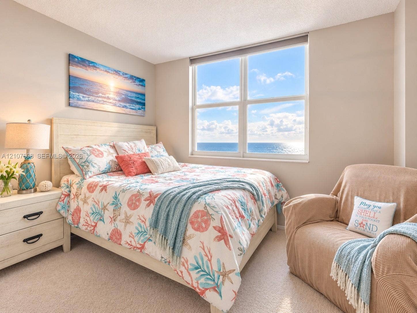 2000 S Ocean Boulevard, #12F, Lauderdale-By-The-Sea, Lauderdale By The Sea, FL 33062 Neutral wall tones, carpeted flooring, and a large multi-pane window featuring an ocean horizon backdrop