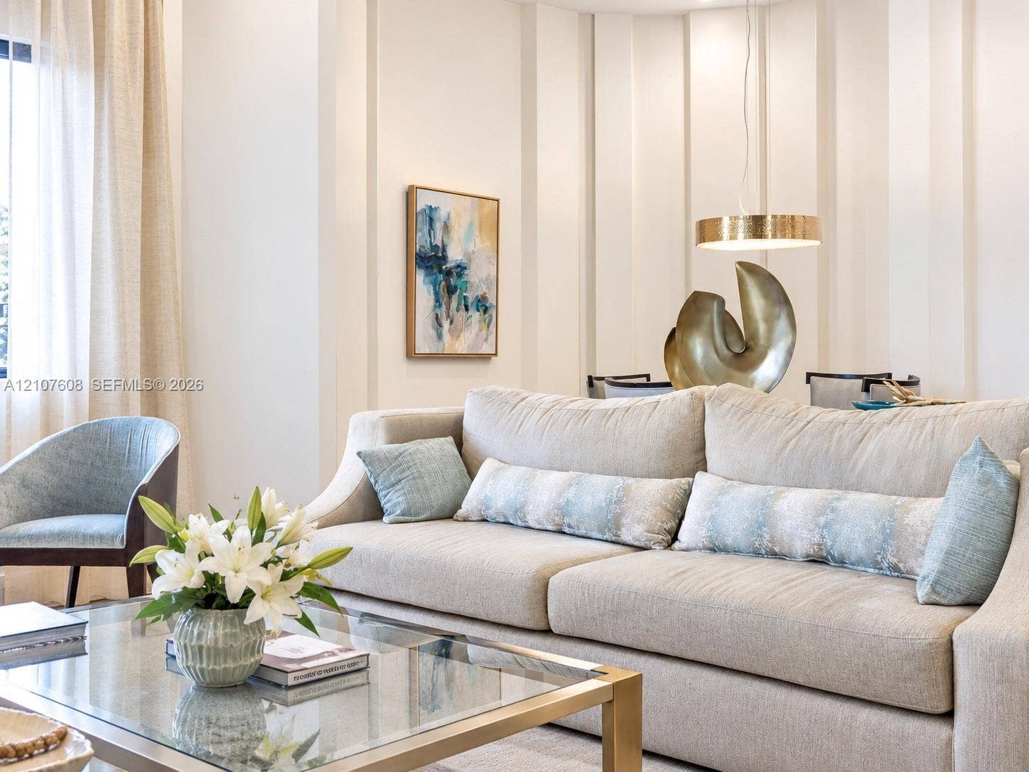 2000 S Ocean Boulevard, #12F, Lauderdale-By-The-Sea, Lauderdale By The Sea, FL 33062 Vertical wall paneling featuring clean lines and a suspended circular metal light fixture