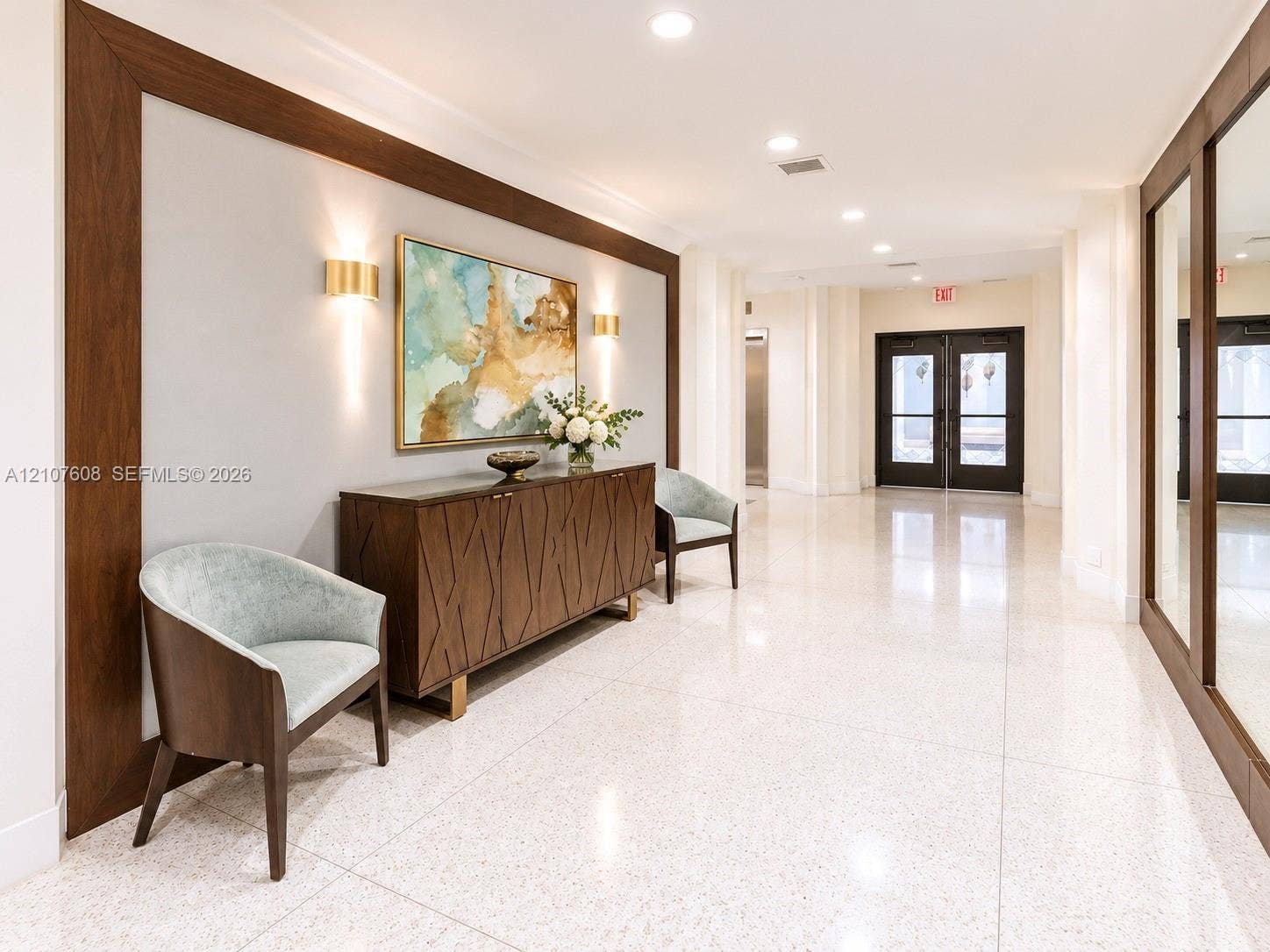 2000 S Ocean Boulevard, #12F, Lauderdale-By-The-Sea, Lauderdale By The Sea, FL 33062 Polished stone flooring, wood-framed wall detailing, recessed ceiling lighting, and brass-finish wall-mounted sconces