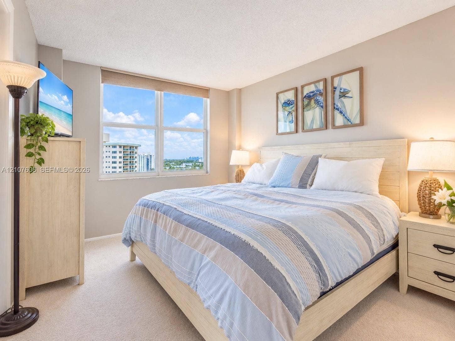 2000 S Ocean Boulevard, #12F, Lauderdale-By-The-Sea, Lauderdale By The Sea, FL 33062 Neutral-toned room featuring a large dual-pane window, wall-to-wall carpeting, and light-toned interior paint