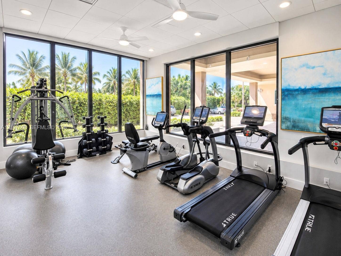 2000 S Ocean Boulevard, #12F, Lauderdale-By-The-Sea, Lauderdale By The Sea, FL 33062 Fitness center featuring floor-to-ceiling windows, recessed lighting, ceiling fans, and durable flooring