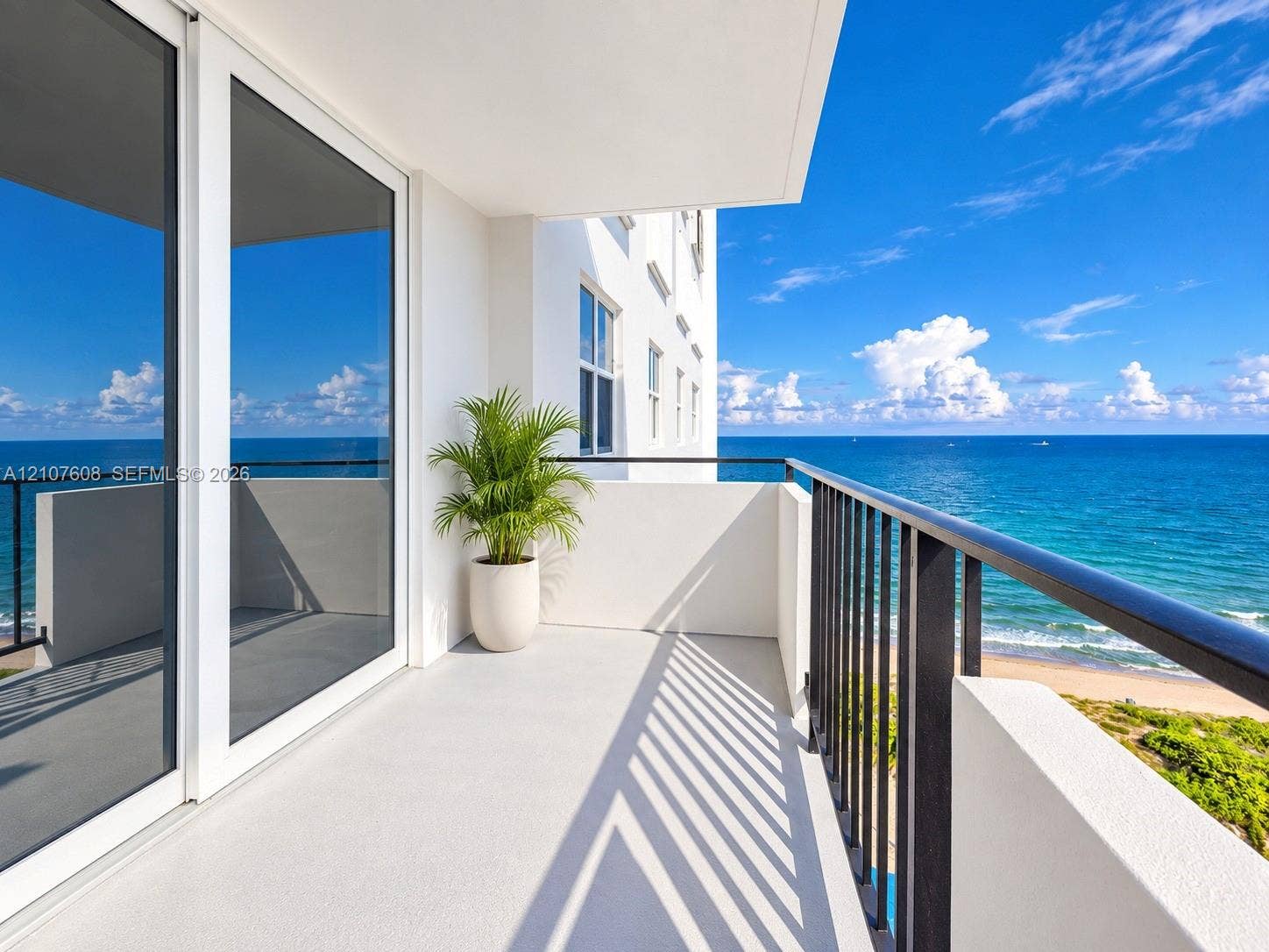 2000 S Ocean Boulevard, #12F, Lauderdale-By-The-Sea, Lauderdale By The Sea, FL 33062 Private balcony featuring a concrete surface, metal railings, and oversized sliding glass doors