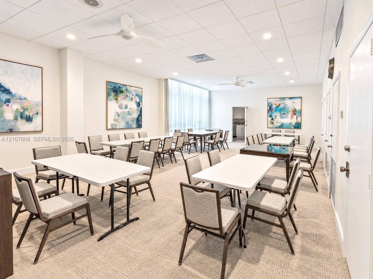 2000 S Ocean Boulevard, #12F, Lauderdale-By-The-Sea, Lauderdale By The Sea, FL 33062 Spacious room featuring neutral carpeting, a drop ceiling with recessed lighting, integrated ceiling fans, and floor-to-ceiling windows