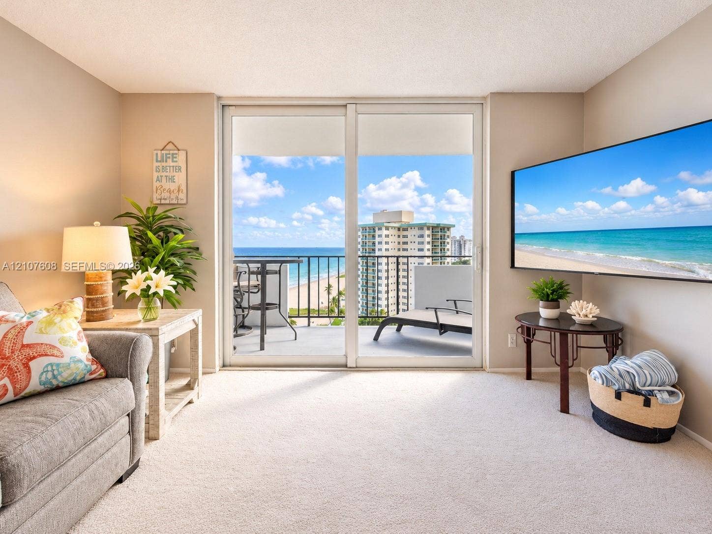 2000 S Ocean Boulevard, #12F, Lauderdale-By-The-Sea, Lauderdale By The Sea, FL 33062 Sliding glass doors opening to a private balcony featuring a metal railing and oceanfront scenery