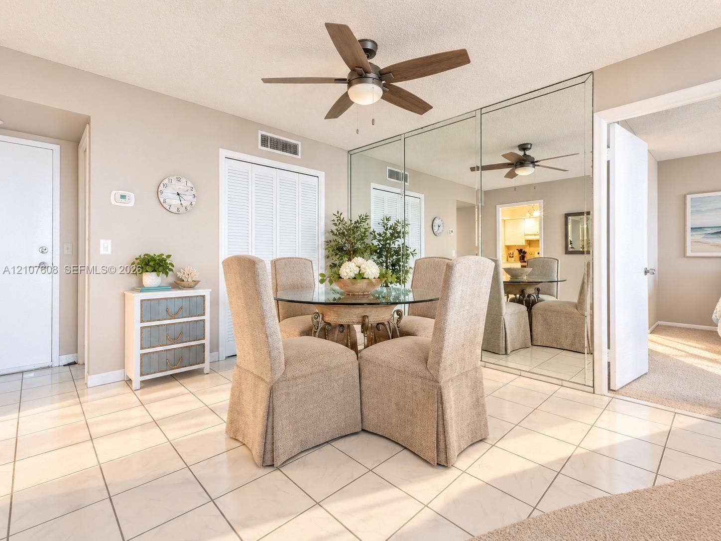 2000 S Ocean Boulevard, #12F, Lauderdale-By-The-Sea, Lauderdale By The Sea, FL 33062 Ceramic tile flooring, full-wall mirrored closet doors, and a ceiling fan with integrated lighting