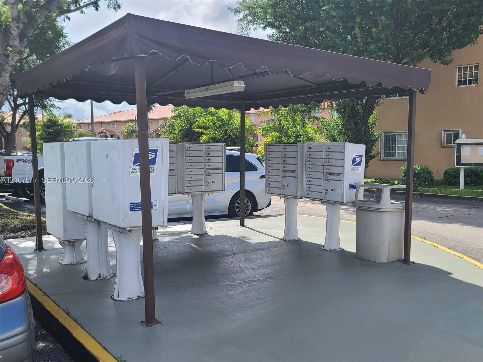 17415 NW 75th Place, #103, Hialeah, Hialeah, FL 33015 Covered community mail station featuring central clustered mailbox units on a concrete pad