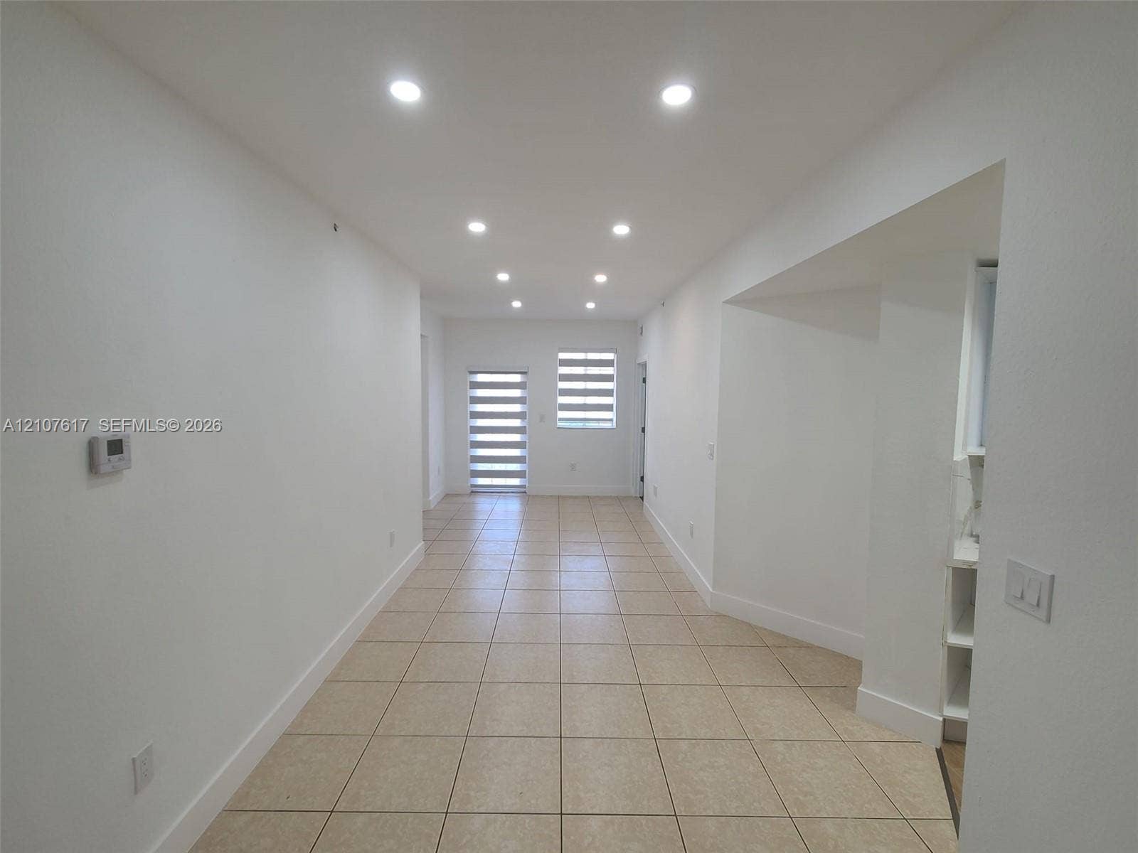 17415 NW 75th Place, #103, Hialeah, Hialeah, FL 33015 Interior space featuring neutral tile flooring, recessed lighting, and tiered roller window shades