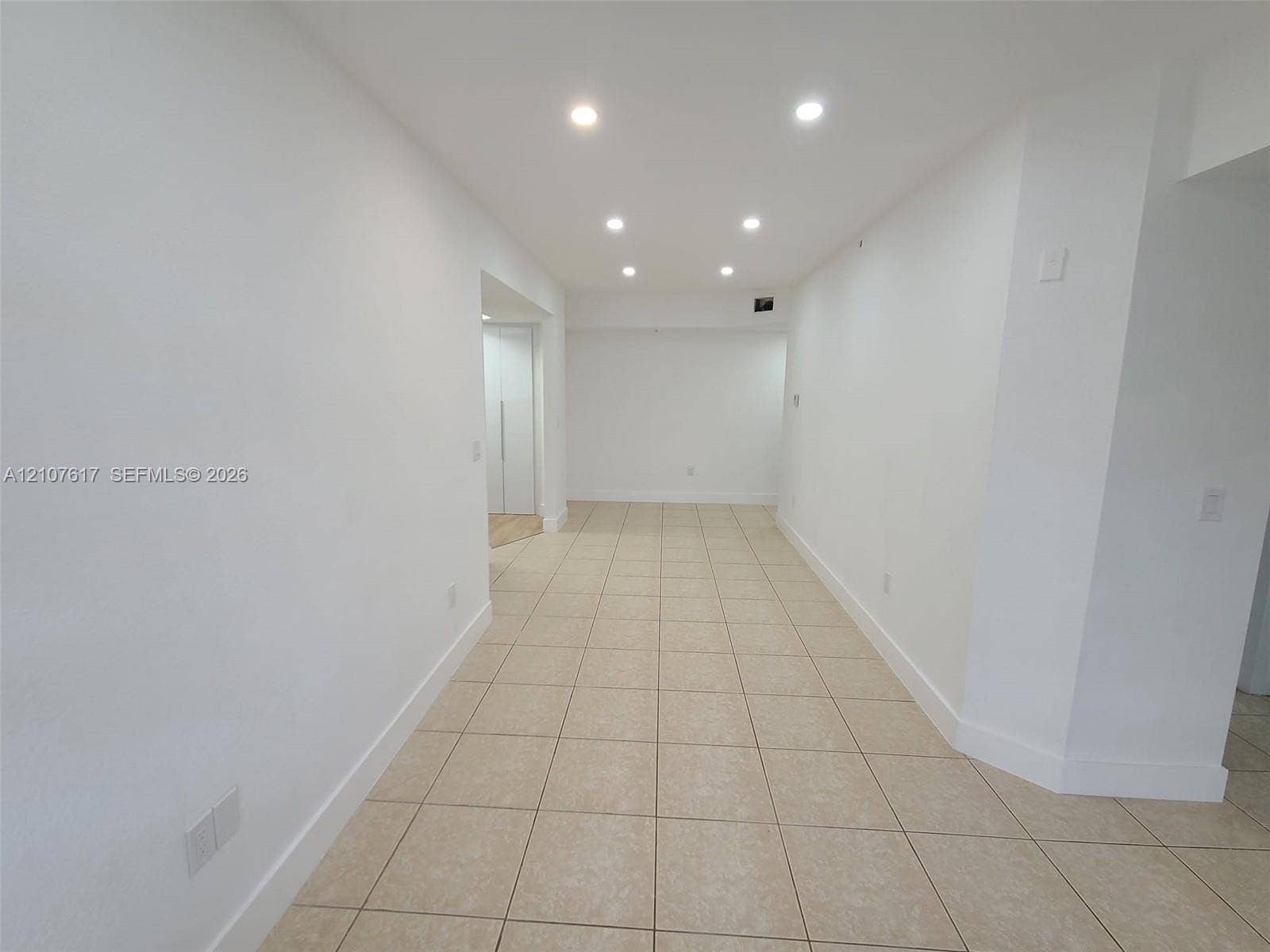 17415 NW 75th Place, #103, Hialeah, Hialeah, FL 33015 Interior space featuring neutral tile flooring, recessed ceiling lighting, and crisp white wall finishes