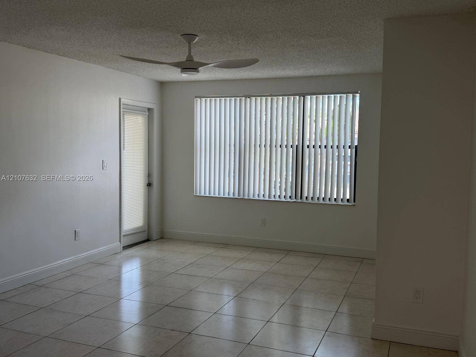 4501 W Mcnab Road, #13, Pompano Beach, Pompano Beach, FL 33069 Interior room featuring tile flooring, a ceiling fan, and a glass-paneled door