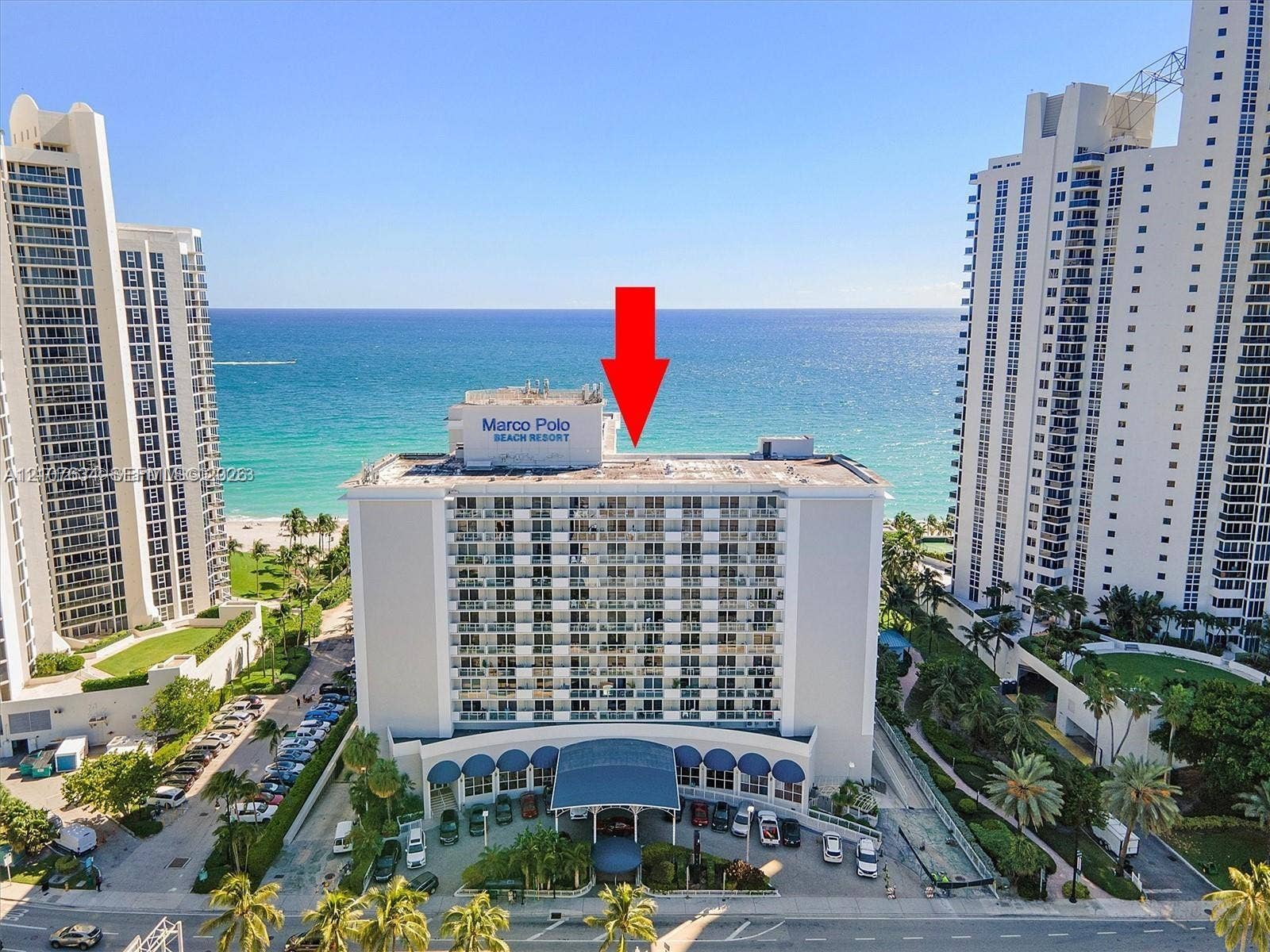 19201 Collins Avenue, #941, Sunny Isles Beach, FL 33160 High-rise beachfront property featuring balconies, a covered entryway, and direct access to the coastline