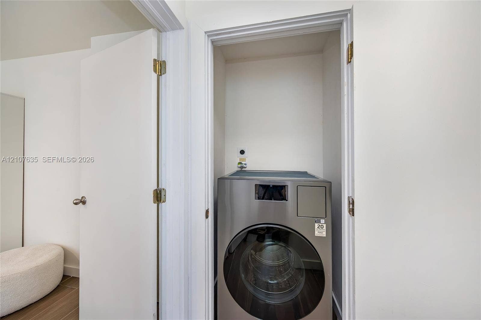 217 Madeira Avenue, #3, Coral Gables, Coral Gables, FL 33134 Laundry closet featuring a stainless steel front-load appliance and a dedicated water hookup