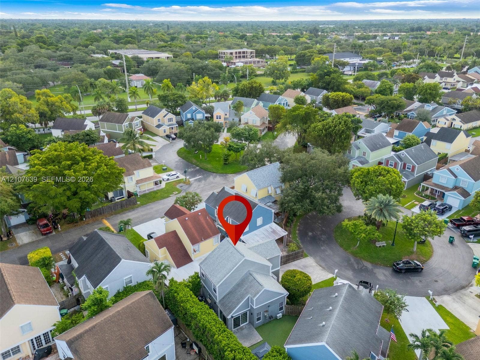 11735 SW 114th Terrace, #11735, Miami, Miami, FL 33186 Aerial perspective of a multi-story residence featuring a shingled roof, paved driveway, and private backyard area