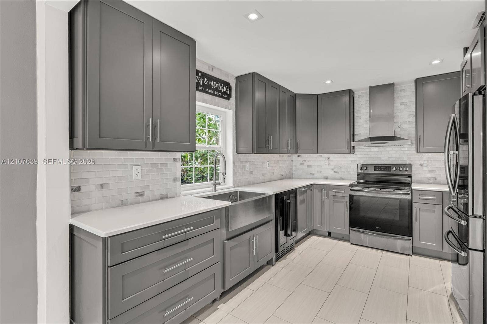11735 SW 114th Terrace, #11735, Miami, Miami, FL 33186 Kitchen featuring shaker-style cabinetry, white countertops, subway tile backsplash, stainless steel apron-front sink, and stainless steel appliances