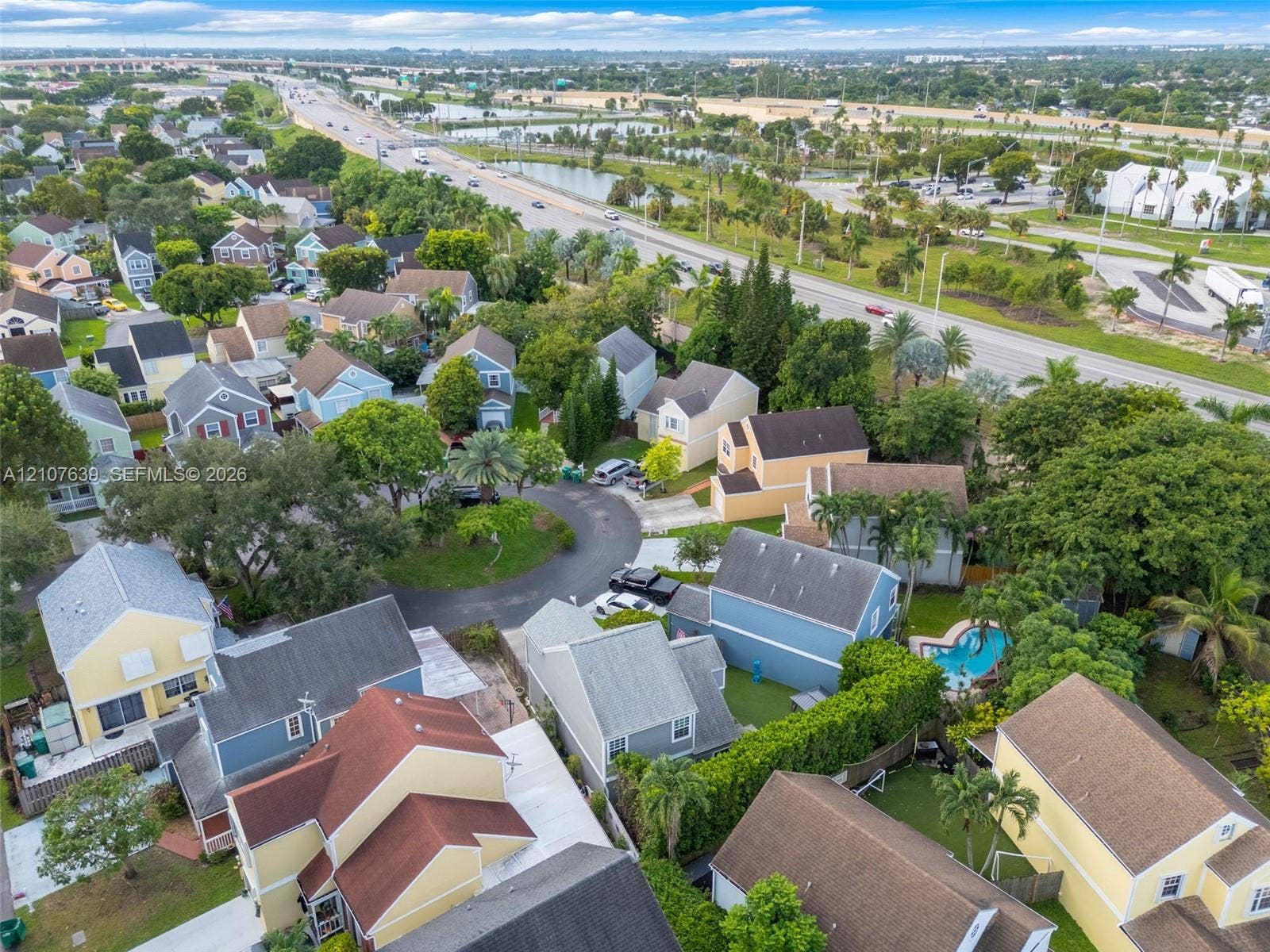 11735 SW 114th Terrace, #11735, Miami, Miami, FL 33186 Aerial perspective of a residential community featuring multi-story dwellings, paved cul-de-sacs, and mature landscaping