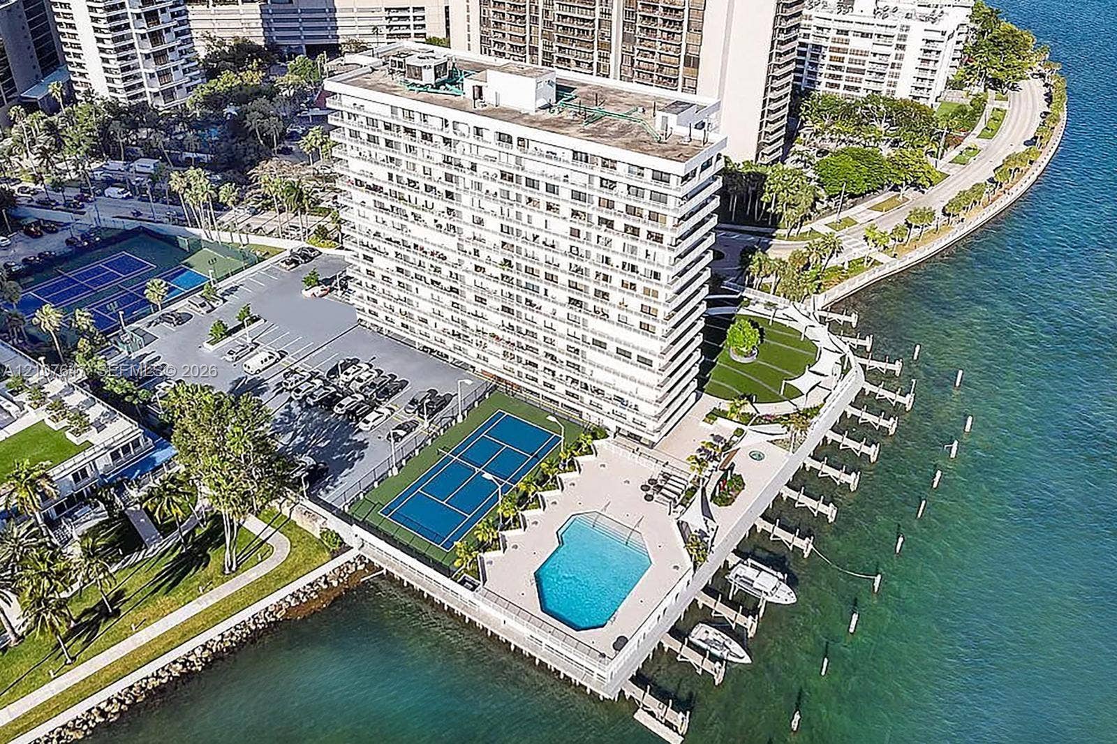 200 SE 15th Road, #PH-A, Miami, Miami, FL 33129 High-rise building featuring a waterfront swimming pool, multiple tennis courts, private boat slips, and landscaped grounds