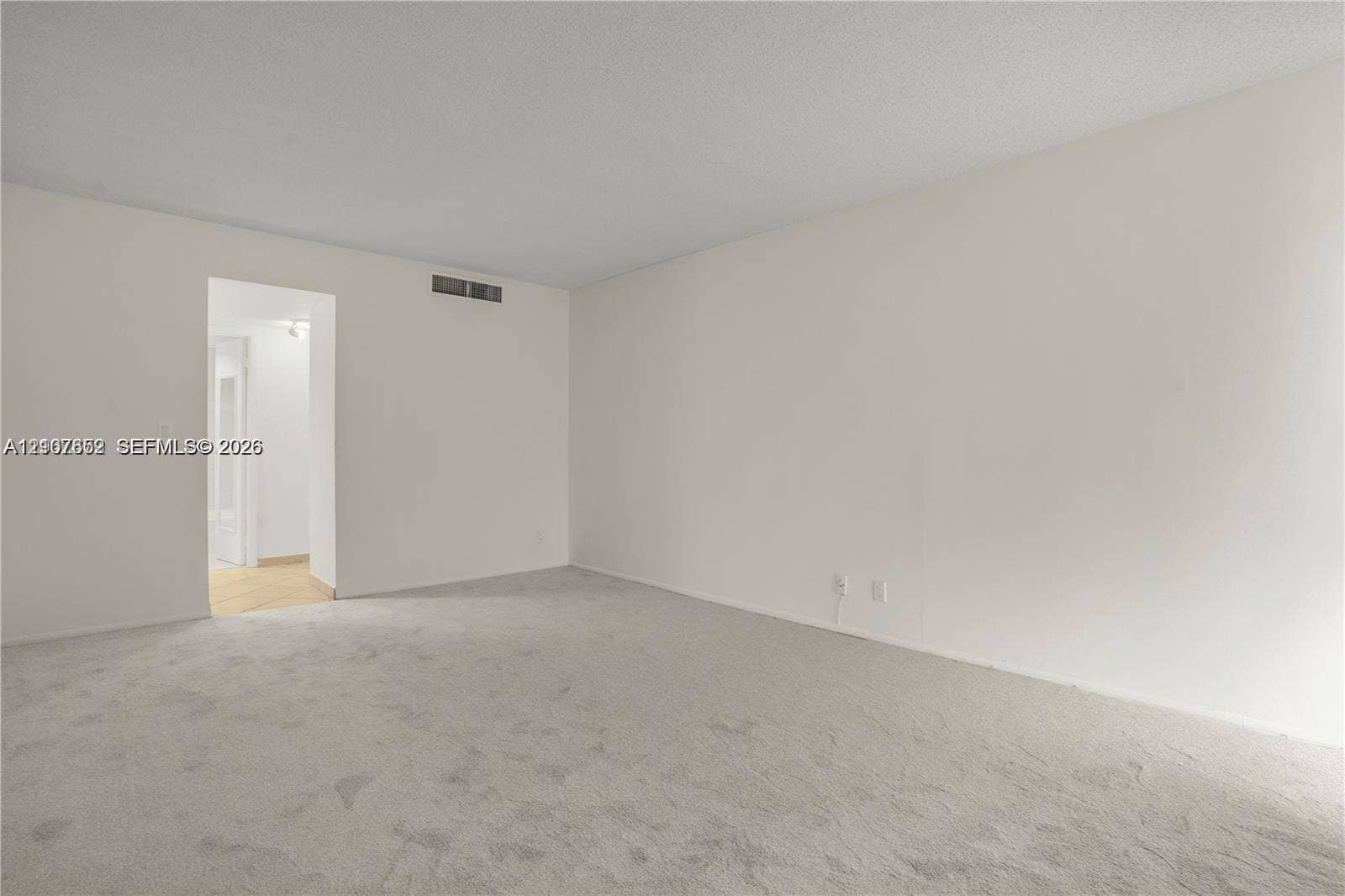 20500 W Country Club Drive, #607, Aventura, Aventura, FL 33180 Interior room featuring neutral wall-to-wall carpeting and smooth-finish walls