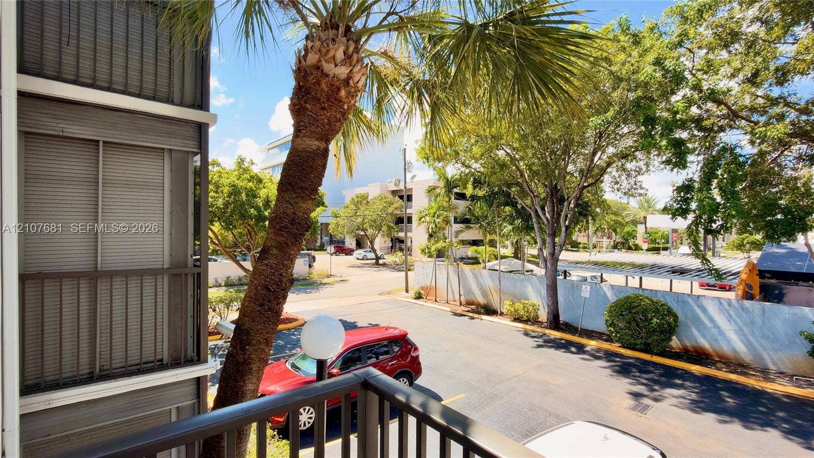 701 NE 1st Court, #202, Hallandale Beach, Hallandale Beach, FL 33009 Private balcony featuring a metal railing and vertical privacy shutter