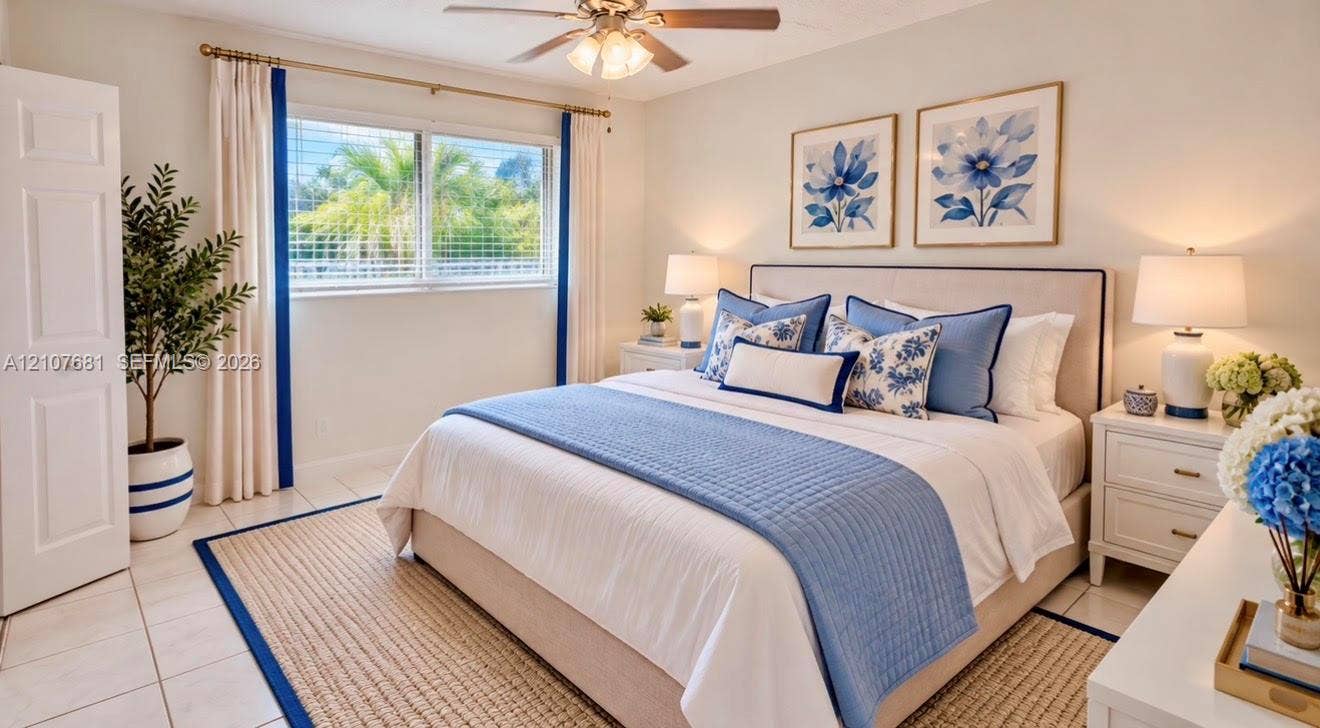 701 NE 1st Court, #202, Hallandale Beach, Hallandale Beach, FL 33009 Kitchen featuring white flat-panel cabinetry, stainless steel appliances, solid-surface countertops, under-cabinet lighting, and tile flooring