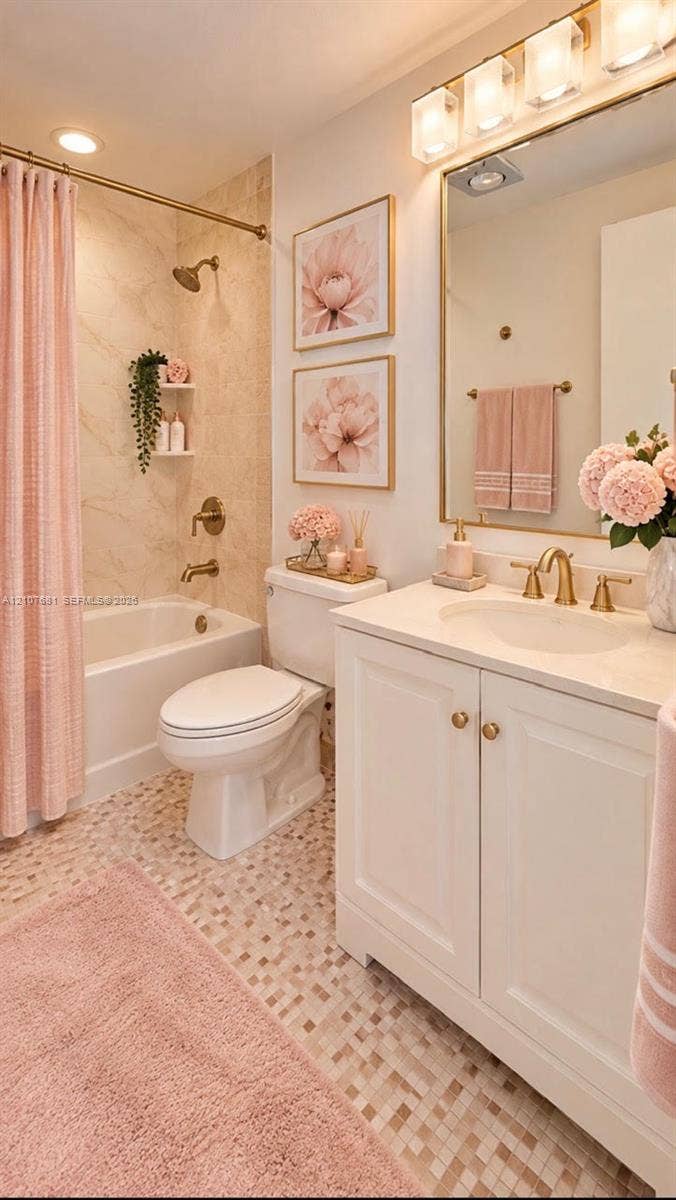701 NE 1st Court, #202, Hallandale Beach, Hallandale Beach, FL 33009 Bathroom featuring a white vanity cabinet with a stone countertop, an oval under-mount sink with brass-finish fixtures, a built-in bathtub with shower surround, a tiled floor, and a framed mirror with integrated lighting