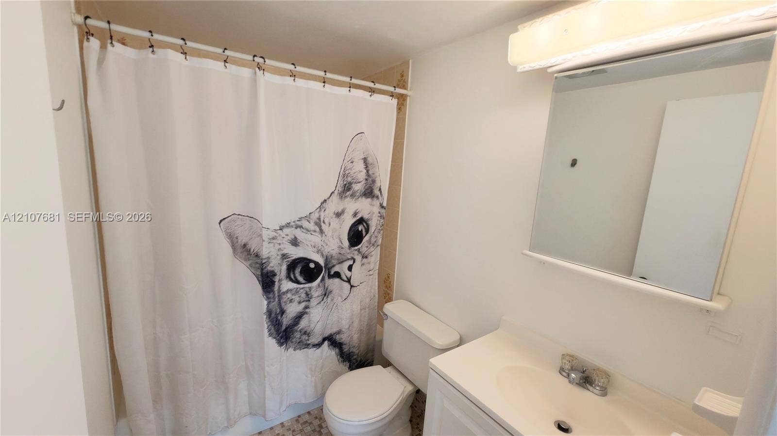 701 NE 1st Court, #202, Hallandale Beach, Hallandale Beach, FL 33009 Bathroom featuring a white vanity cabinet, integrated sink with a chrome faucet, wall-mounted medicine cabinet, and a tub-shower combination