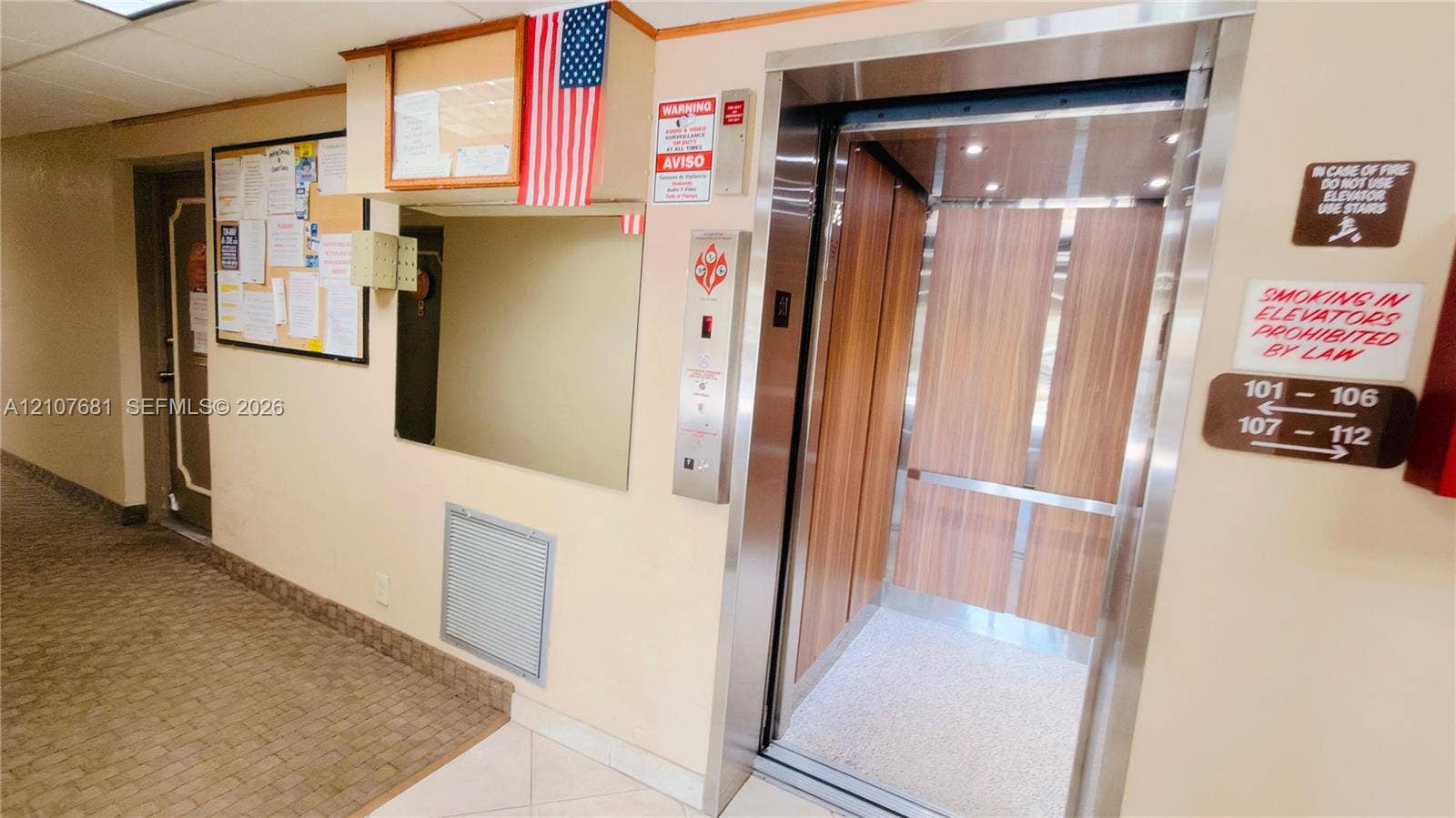 701 NE 1st Court, #202, Hallandale Beach, Hallandale Beach, FL 33009 Elevator featuring brushed metal trim and wood-finish interior paneling