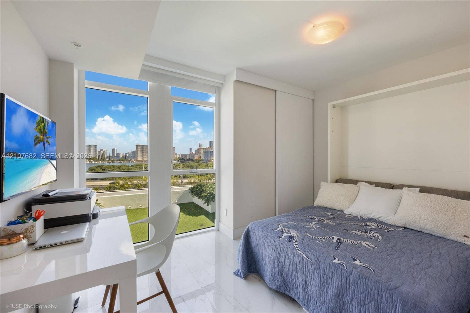 400 Sunny Isles Boulevard, #704, Sunny Isles Beach, Sunny Isles Beach, FL 33160 Floor-to-ceiling windows, white tile flooring, built-in wall cabinetry, and recessed ceiling lighting