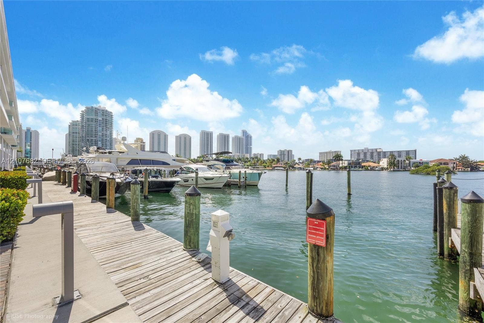 400 Sunny Isles Boulevard, #704, Sunny Isles Beach, Sunny Isles Beach, FL 33160 Private deep-water dock featuring wooden decking and integrated mooring pilings