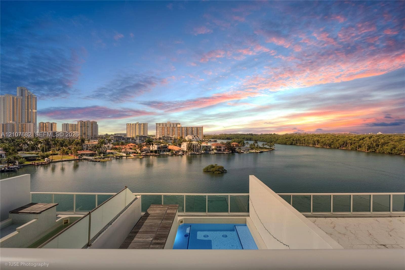 400 Sunny Isles Boulevard, #704, Sunny Isles Beach, Sunny Isles Beach, FL 33160 Terrace featuring a plunge pool, wood-finish decking, glass panel railing, and water scenery