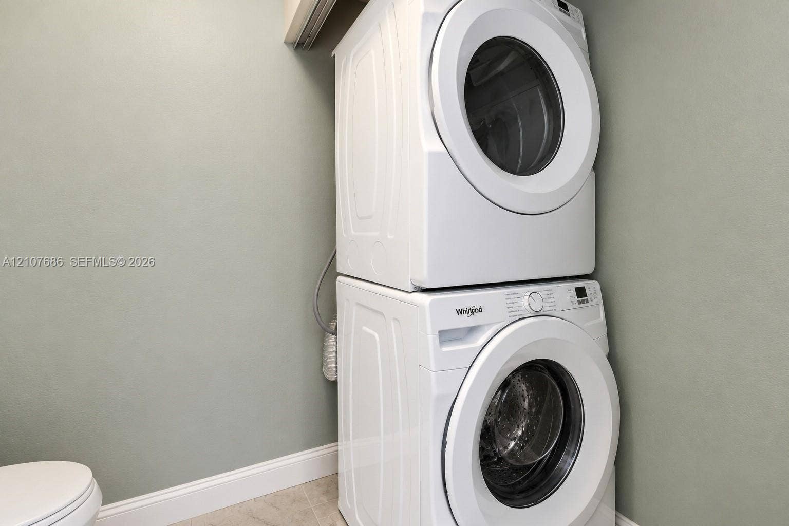 9760 Jamaica Drive, Cutler Bay, FL 33189 Stacked white front-load washer and dryer unit