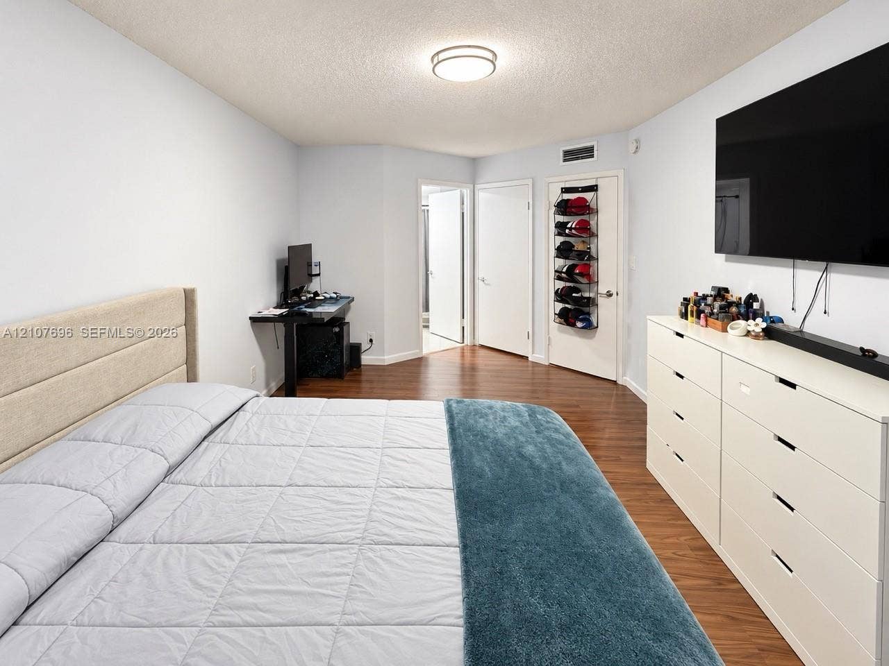 8290 Lake Drive, #418, Doral, FL 33166 Wood-finish flooring, flush-mount ceiling lighting, and solid-core interior doors