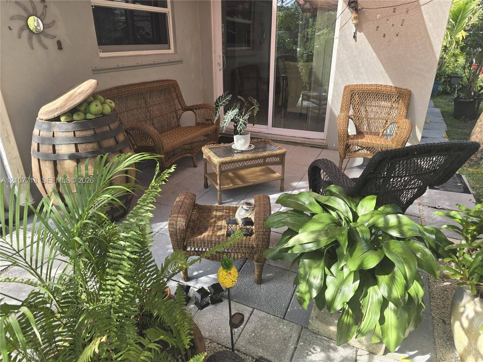 2321 N 57th Avenue, Hollywood, FL 33021 Paved patio featuring large-format concrete tiles and a sliding glass door