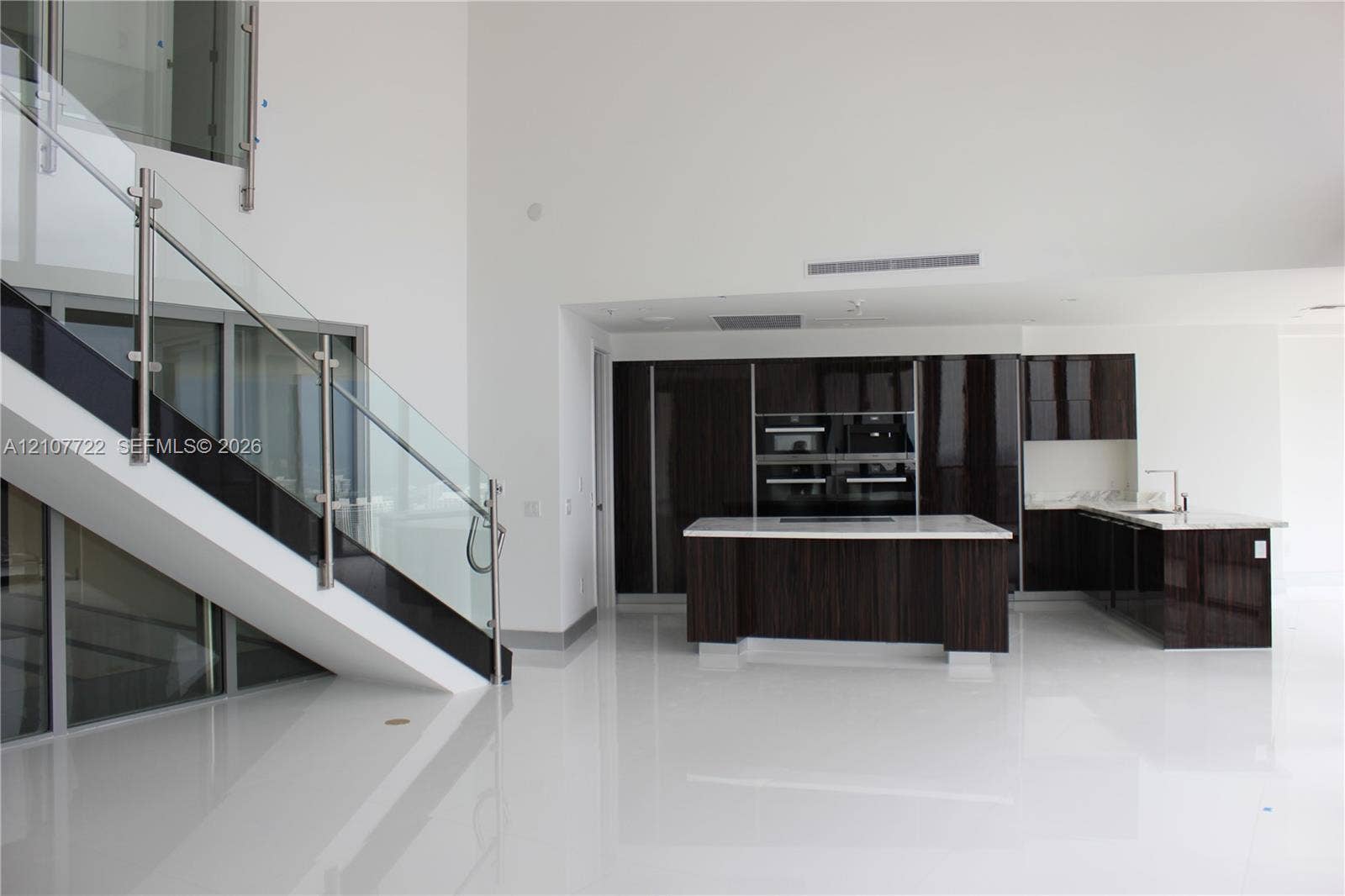 18555 Collins Avenue, #4604, Sunny Isles Beach, Sunny Isles Beach, FL 33160 Kitchen and stairs