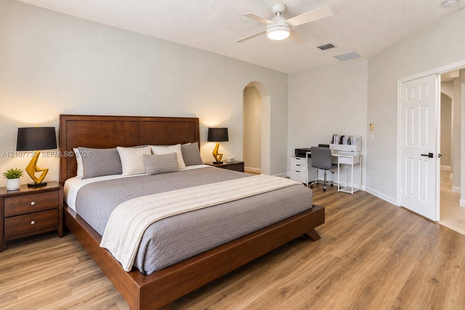 15606 SW 52nd Court, Miramar, FL 33027 Room featuring wood-finish flooring, vaulted ceiling with a central integrated ceiling fan, and a neutral color palette