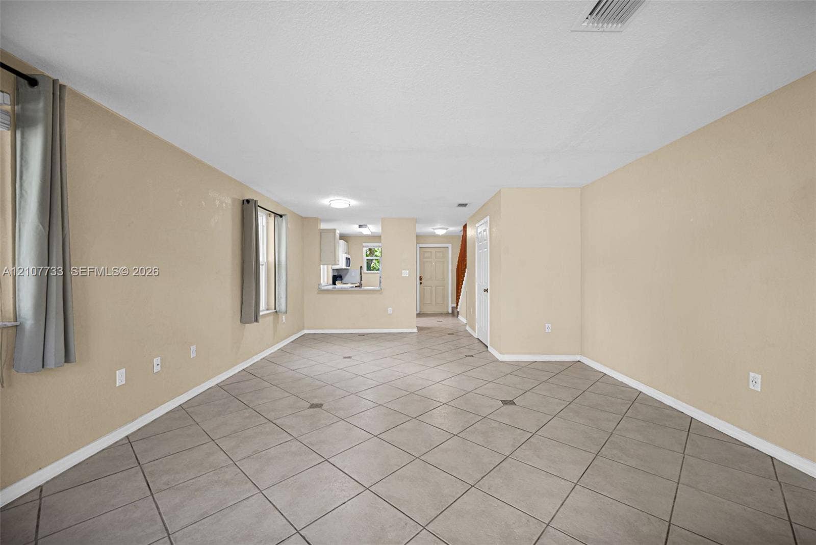 19606 SW 103rd Court, #4, Cutler Bay, FL 33157 Open-concept interior featuring large-format diagonal tile flooring, neutral wall tones, and recessed ceiling lighting