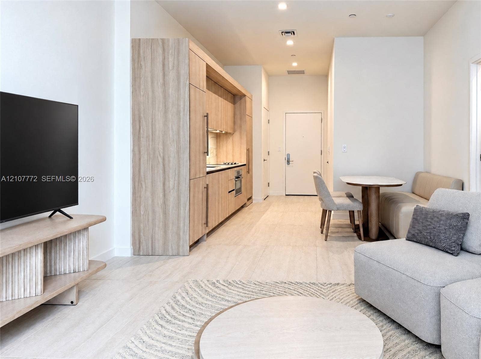 77 SE 5th Street, #1210, Miami, Miami, FL 33131 Kitchen featuring flat-panel wood-finish cabinetry, integrated appliances, and recessed lighting throughout