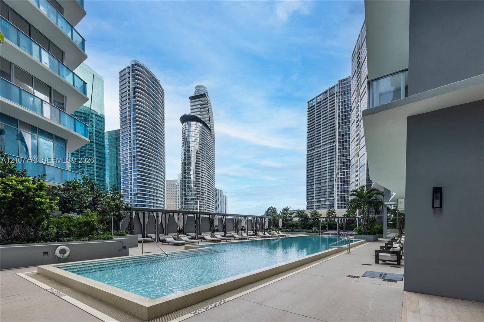77 SE 5th Street, #1210, Miami, Miami, FL 33131 Rectangular swimming pool with integrated stair entry, concrete decking, and covered pergola structure