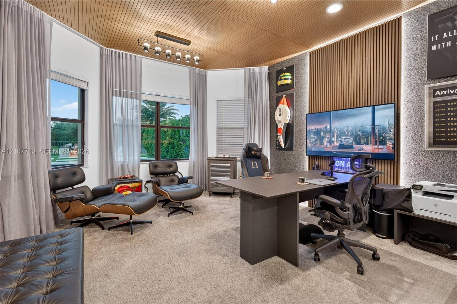 9328 Tropez Lane, Delray Beach, FL 33446 Curved wood-slat ceiling, vertical wood-slat feature wall with integrated LED accent lighting, multi-pane windows, and linear overhead pendant lighting