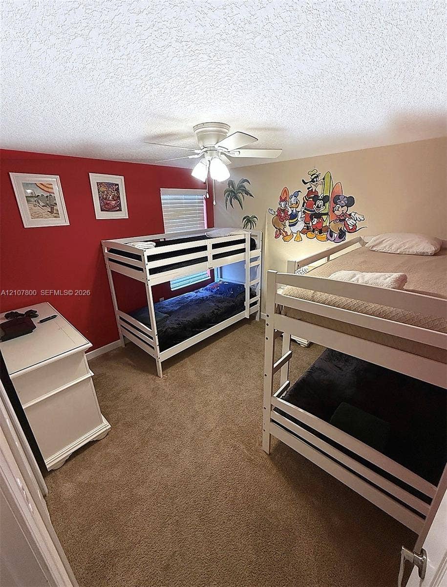 1476 Moon Valley, Davenport, FL 33896 Textured ceiling with a ceiling-mounted light fixture and fan, carpeted flooring, and a single window with horizontal blinds