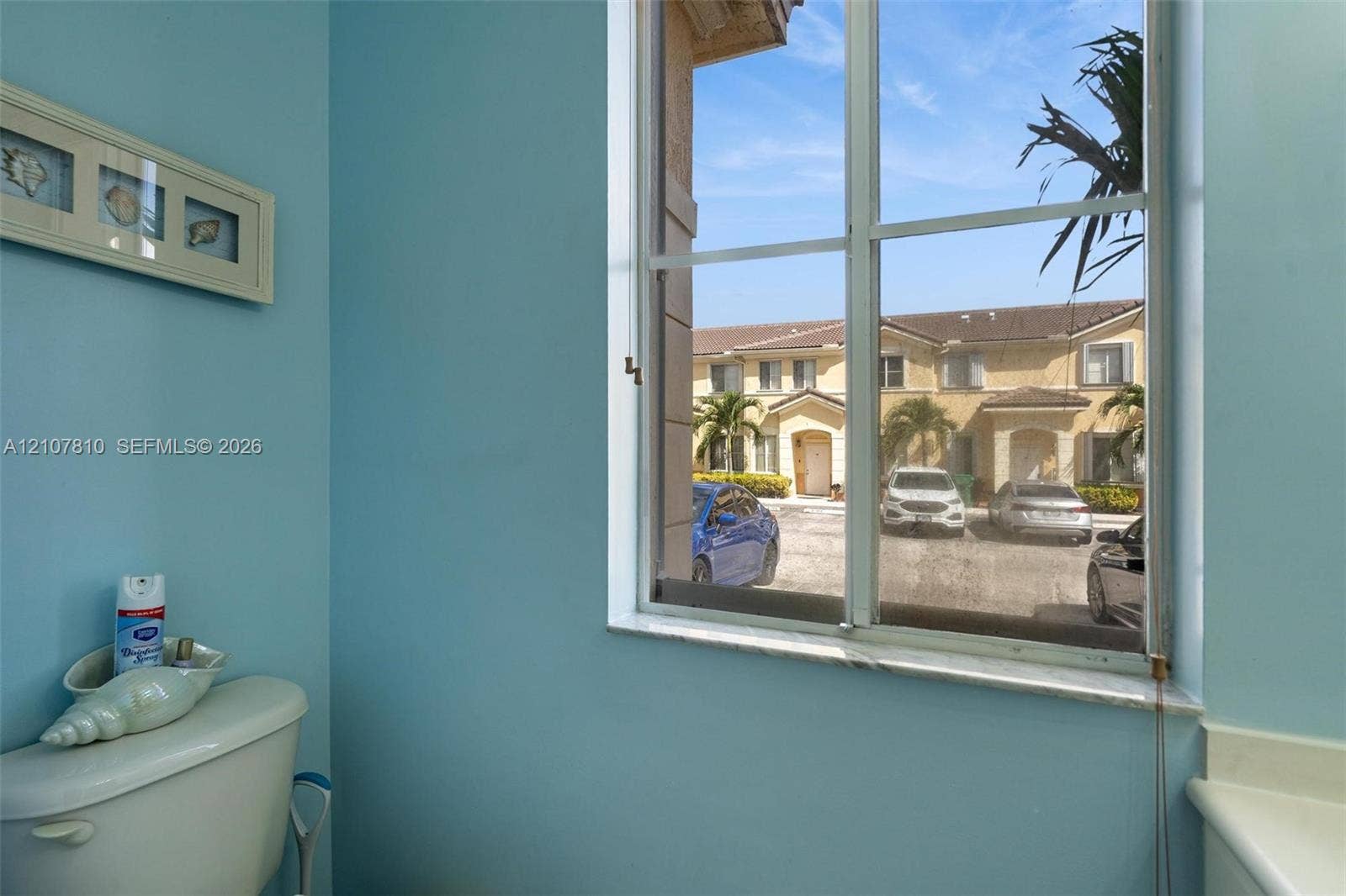 6940 NW 177th Street, #P105, Hialeah, Hialeah, FL 33015 Large multi-pane window with a neutral stone sill