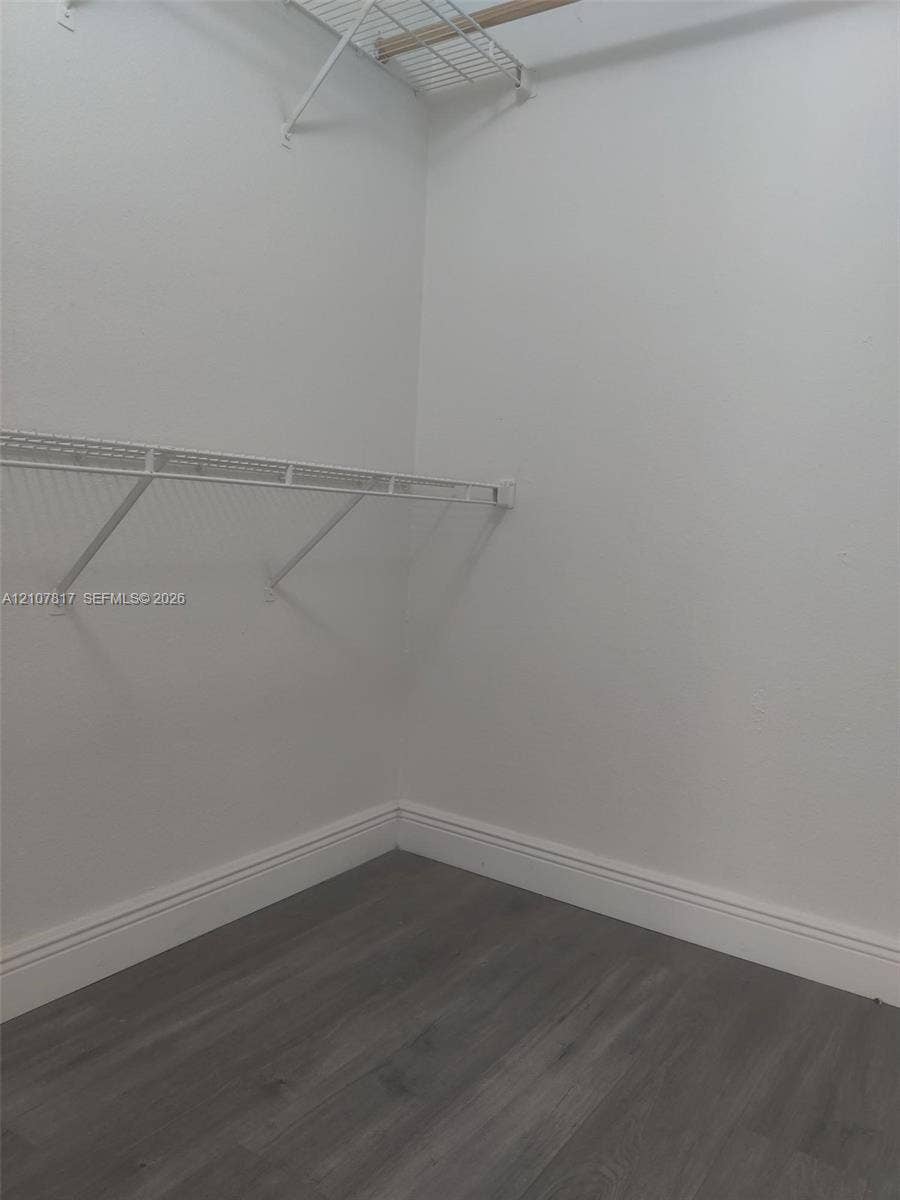 1705 Palm Cove Boulevard, #1-104, Delray Beach, Delray Beach, FL 33445 Storage area featuring wood-finish flooring and dual-level wire shelving